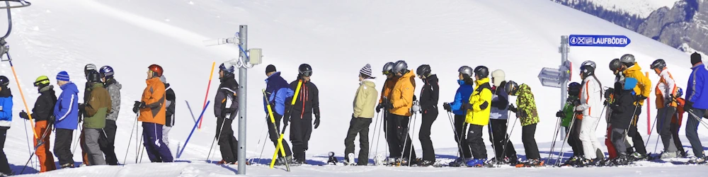 Skiers queuing for the ski lift