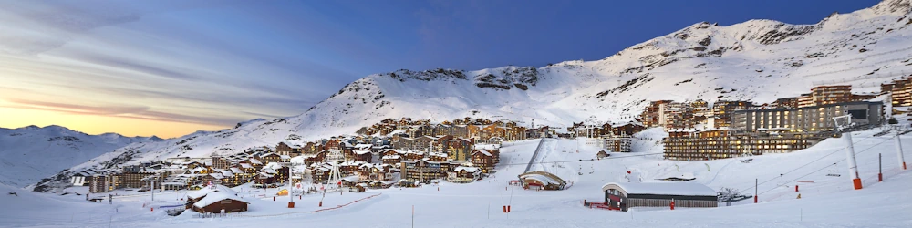 Expansive view of village in the Alps just before sunset